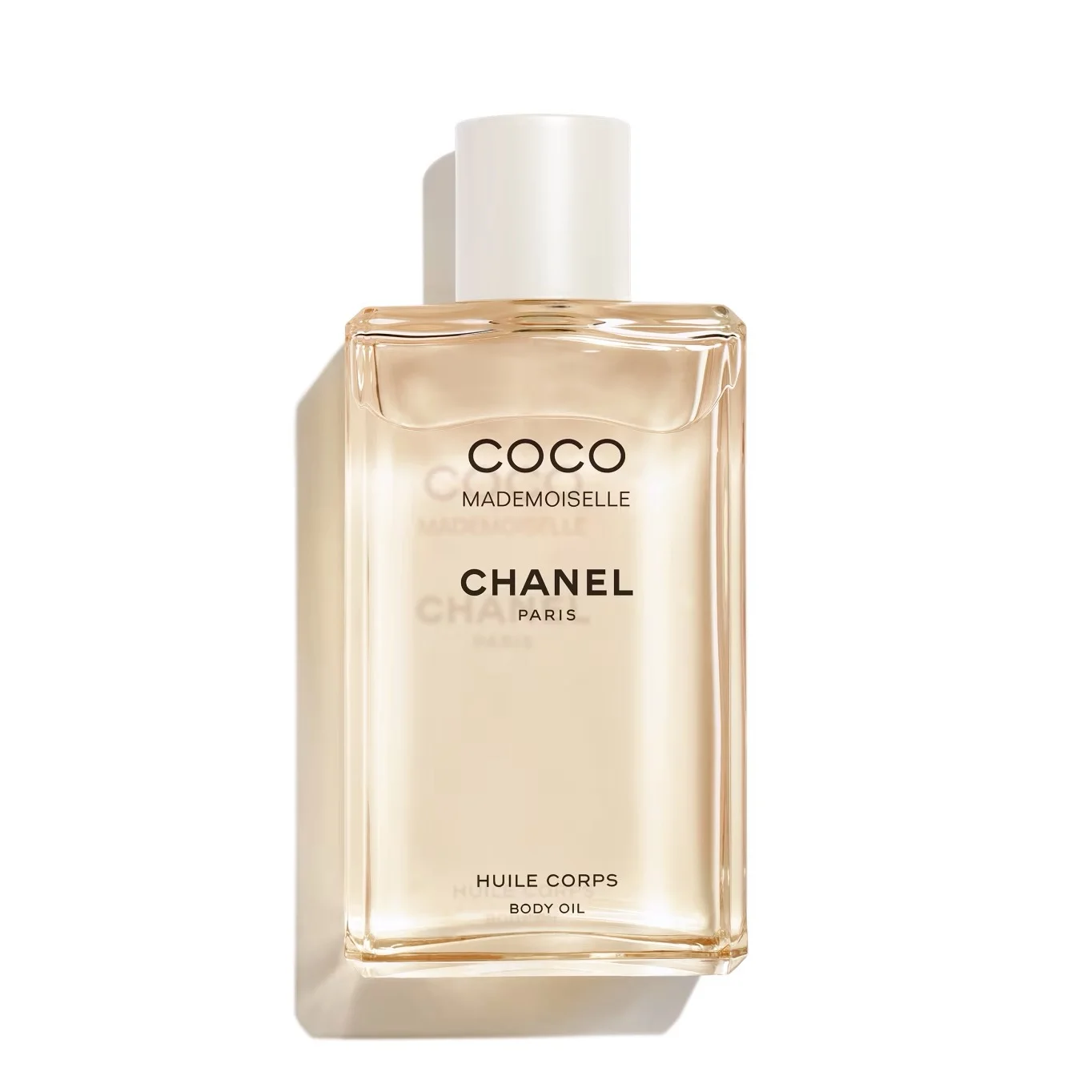 Collection of luxury brand body oils featuring Chanel